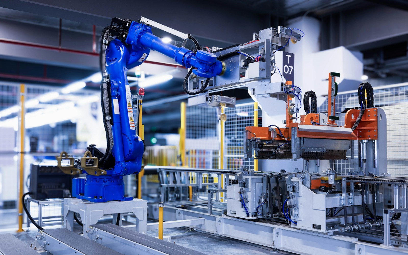 Illustrative photograph of industrial robot production equipment.